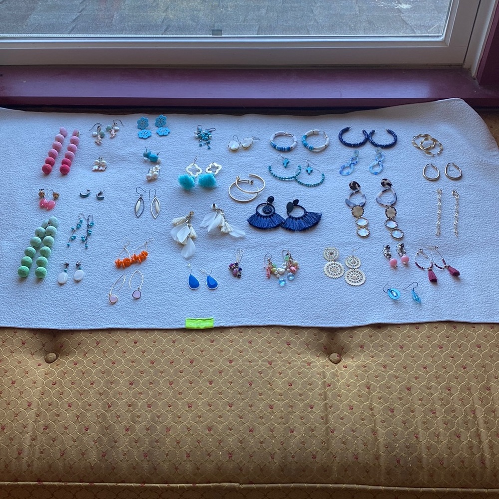 36 pairs of earrings Many need to be polished. Think hoops are Kendra Scott